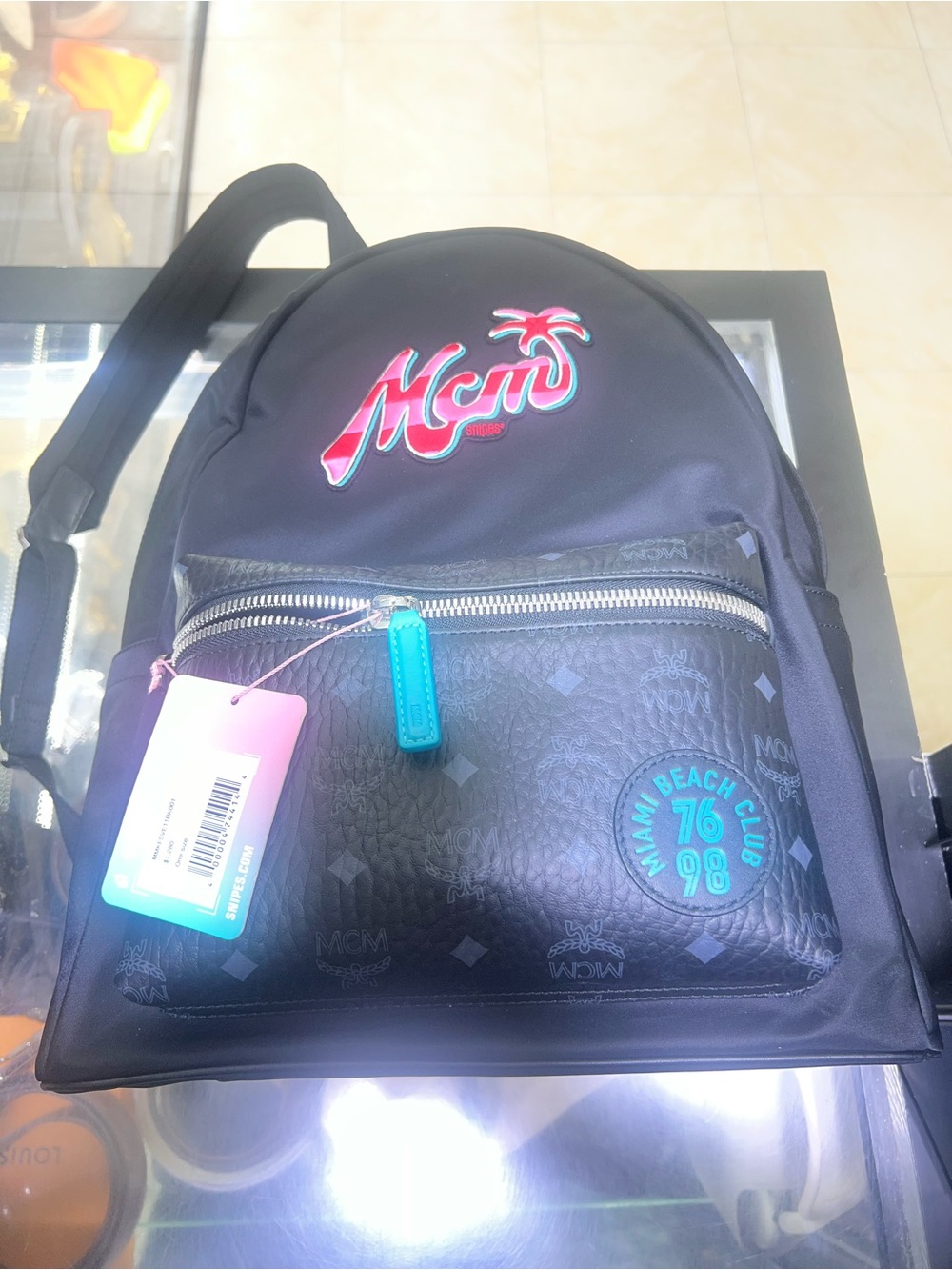 MCM Black Backpack with Teal and Pink Logo Accents